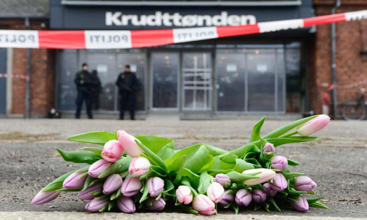 Flowers are placed at the site of a shooting in Copenhagen.