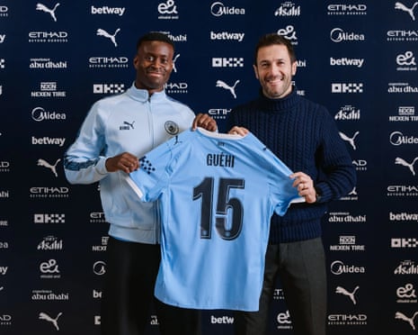 Marc Guehi signing for Manchester City, alongside director of football Hugo Viana.
