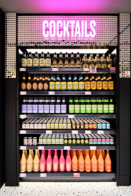 Alcoholic drinks on display in the M&S Pantheon store, along with a neon sign that reads ‘Cocktails’