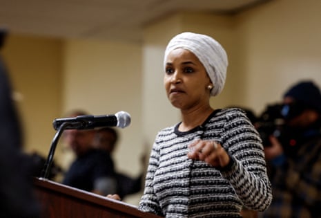 Ilhan Omar reacts as a man disrupts, spraying an unidentified liquid in her direction during a town hall in Minneapolis, Minnesota, 27 January, 2026.
