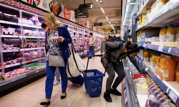 Customers shop in a Lidl supermarket