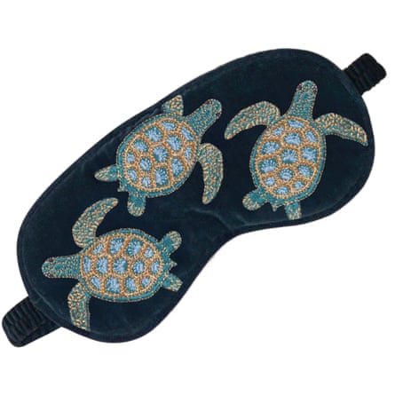 Elizabeth Scarlett soft Eye Mask. The eye mask has three embrodered turtles.