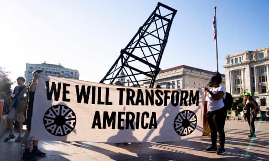 Climate activists march outside the White House to protest against fossil fuel use and to urge Joe Biden to prioritize clean energy climate policy.