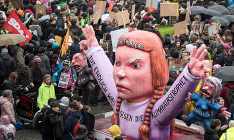 In Germany youths demonstrate with banners and placards and a figure depicting young Swedish climate activist Greta Thunberg