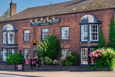 Large old brick pub with bay windows. The Gaskell Arms, at Victoria Road/Bridgnorth Road junction, Much Wenlock, Shropshire