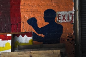 A mural pictured in the ruined interior of Cutty’s boxing gym, photograph by JM Giordano