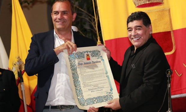 Maradona, right, receives the honorary citizenship of Naples from Luigi De Magistris in 2017