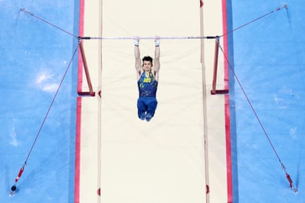 Heath Thorpe photographed from above competes on the horizontal bar