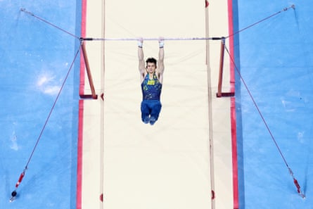 Heath Thorpe photographed from above competes on the horizontal bar