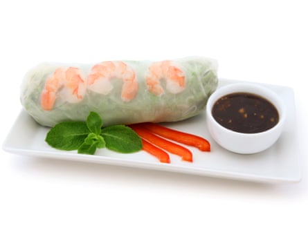 A shrimp spring roll with peanut dipping sauce