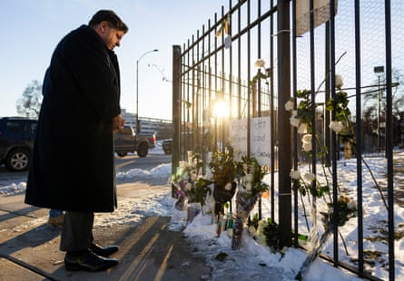a man paying his respects at a memorial
