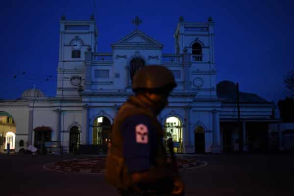 A security official stands guard outside St Anthony’s Shrine in Colombo in 2019, two days after the church was hit in a series of bomb blasts.