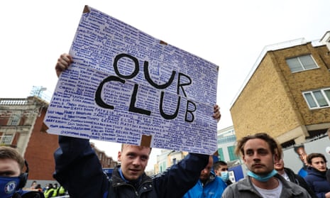 Chelsea fans gather to protest the introduction of the European Super League before the game against Brighton