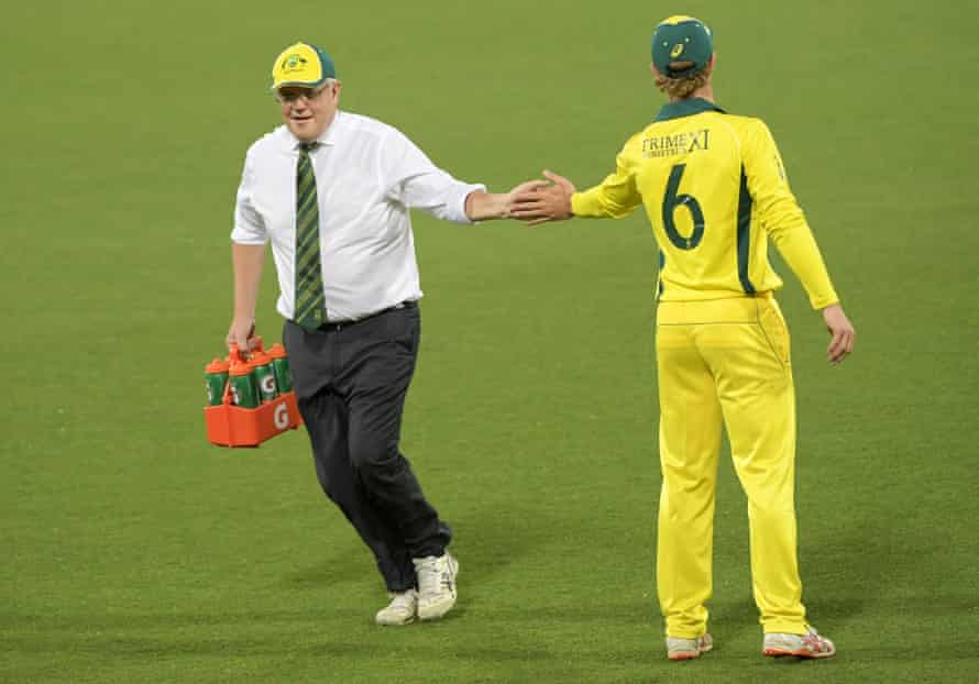 The Australian prime minister, Scott Morrison, runs water during the tour match between Prime Minister’s XI and Sri Lanka at Manuka Oval