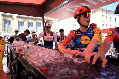 riders immerse their hands in ice