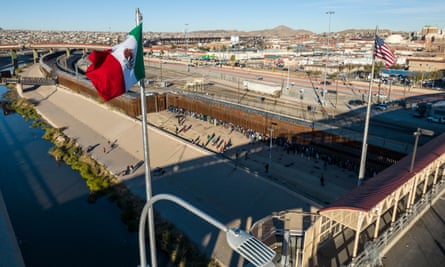 An aerial view of the Mexican and US flags fly over an international bridge in El Paso, Texas. Chaos has not engulfed the border since pandemic-era restrictions expired but migration is unlikely to go away as an issue.