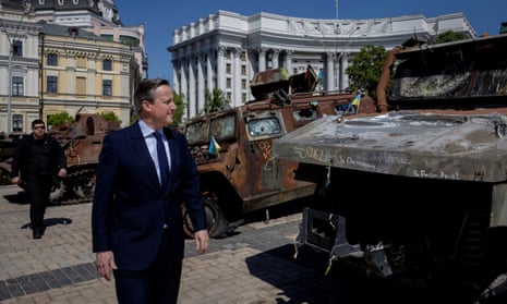 Britain’s Foreign Secretary David Cameron walks past a display of destroyed Russian military vehicles in Saint Michael’s Square, amid Russia’s attack on Ukraine, in Kyiv, Ukraine, May 2, 2024.