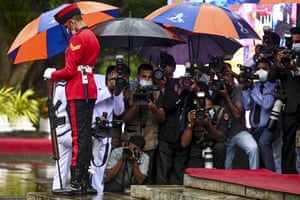 Photographers and military personnel at a Remembrance Day ceremony in Colombo, Sri Lanka