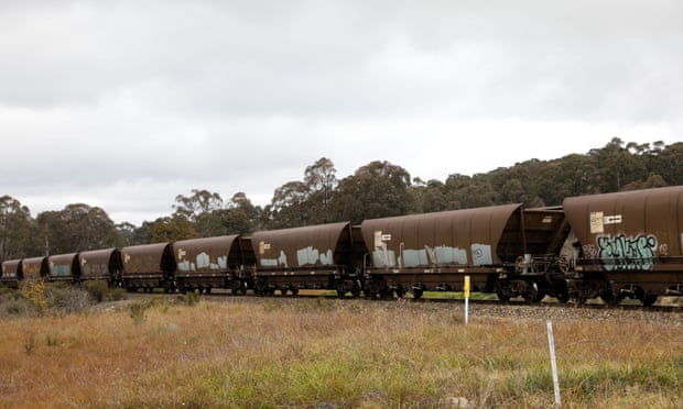 A coal train travelling across train tracks near the Wallerawang power station in NSW.