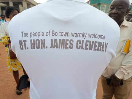 Someone wearing a T-shirt with "The people of Bo Town warmly welcome Rt Hon James Cleverly" written on it. 
