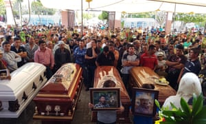 Relatives and friends of four people killed in a clash with soldiers participate in a funeral mass in Palmarito Tochapan, Puebla, Mexico, on 7 May 2017.
