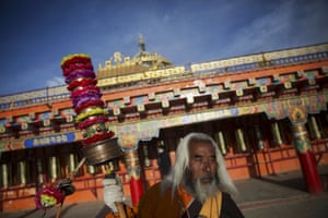 Padma Tsering, a well-known Tibetan Buddhist monk, spins his prayer wheels