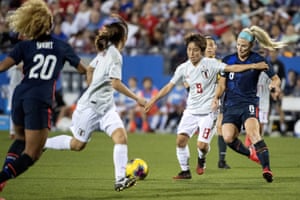 Mana Iwabuchi (second right) in action for Japan against the USA in March.