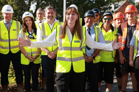Angela Rayner, in a hi-vis jacket surrounded by other people in hi-vis jackets and hard hats