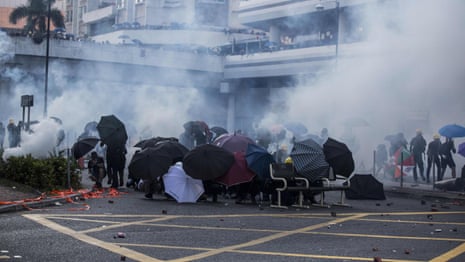 Hong Kong protesters use chairs as barricade during riots – video
