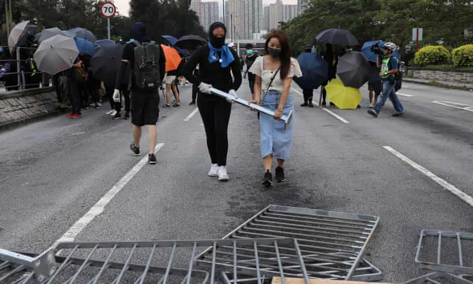 Anti-government protesters set up a barricade in Tai Po district in Hong Kong.