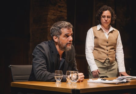 Wagner Moura, seated, speaks in a trial setting