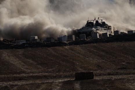 An Israeli military vehicle moves near the border of the Gaza Strip, 3 June.
