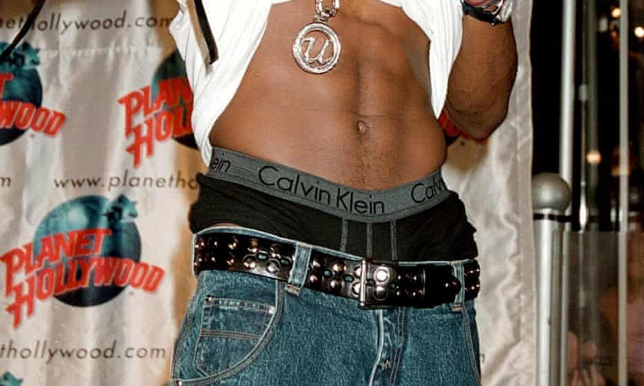 Usher shows his CK waistband.
