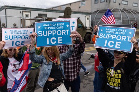 People holding up signs