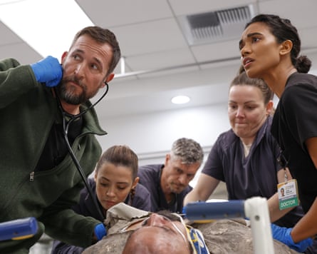 Noah Wyle, left, in a scene from The Pitt.