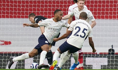 Raheem Sterling (left) wheels away to celebrate his early header which proved to be the winner against Arsenal.