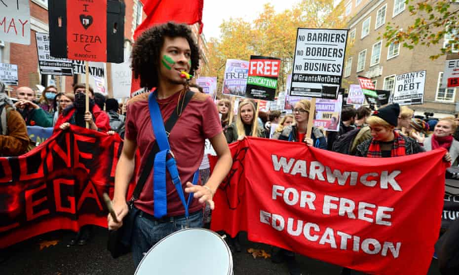 Students protesting against tuition fees, which make up part of the average undergrad debt of £50,000. 