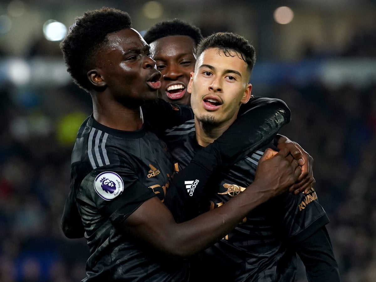 Soccer-Arsenal move top of the league with 2-0 win over Brighton