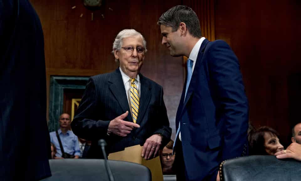 Mitch McConnell speaks with Judge Justin Walker during a Senate hearing for several judicial nominations, on Capitol Hill in Washington DC on 31 July 2019.