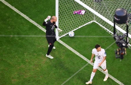 Vanja Milinkovic-Savic (left) and Milos Veljkovic look dejected after Cameroon’s Eric Maxim Choupo-Moting brings the game level at 3-3.
