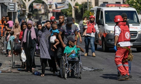 Residents of the Jenin refugee camp flee their homes as the IDF presses ahead with its operation in the West Bank today.