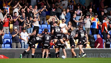 London Broncos players celebrate beating Catalans Dragons in 2024