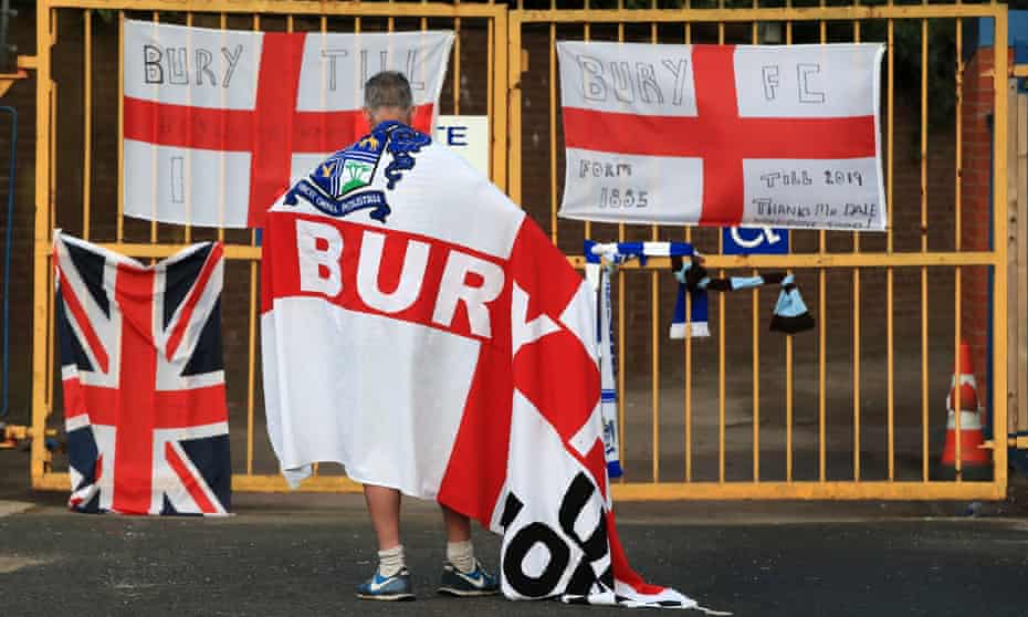 A supporter mourns the expulsion of Bury outside the club’s Gigg Lane stadium last month.