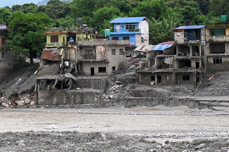 Damaged houses covered in sludge in the aftermath of flash floods at Devighat in Nepal’s Nuwakot district on 5 September.