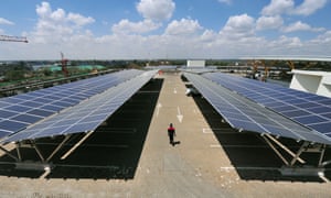 Solar panels are installed on a carport at Garden City shopping centre in Nairobi, Kenya.