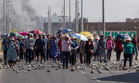 A group of people protest in Tacna, Peru, on 11 January.