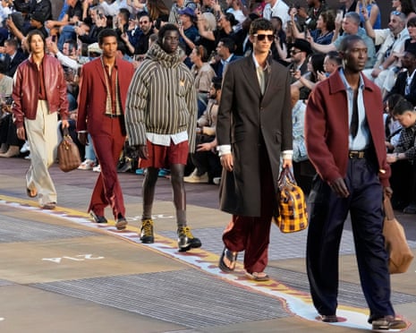 Models wear outfits from Louis Vuitton spring-summer 2026 collection during a show at Paris fashion week on Tuesday.