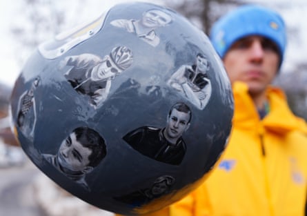 Ukraine’s Vladyslav Heraskevych, with his helmet, which features pictures of people killed in the war with Russia