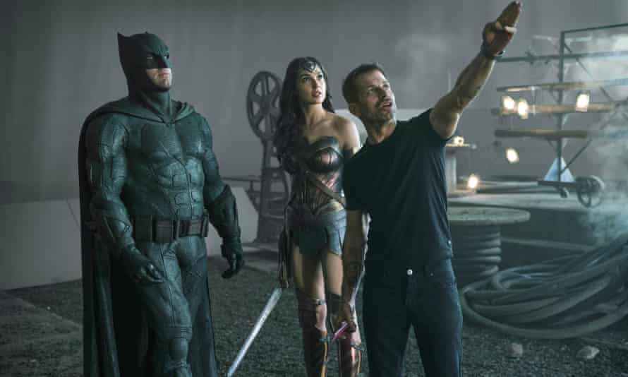 Snyder on the set of Justice League, with Ben Affleck as Batman and Gal Gadot as Wonder Woman.