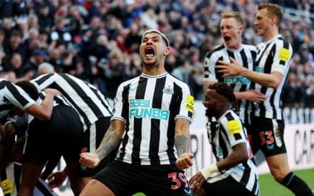 Newcastle United’s Bruno Guimarães – gum in mouth – celebrates a goal.